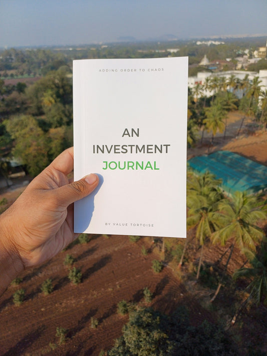 A person holding a book in their hand