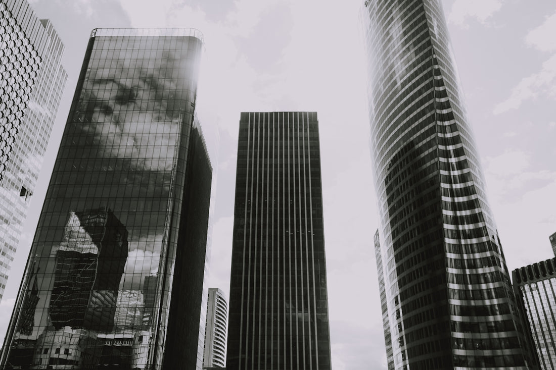 grayscale photography of curtain-wall high-rise buildings