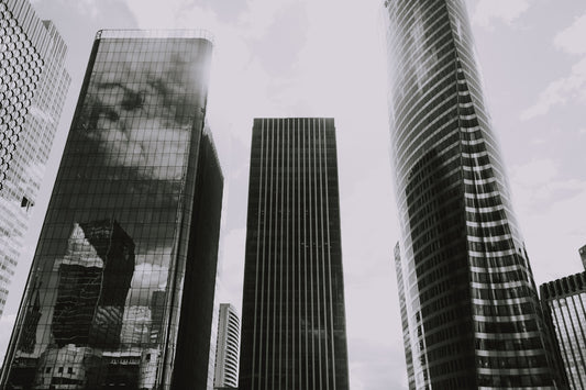 grayscale photography of curtain-wall high-rise buildings