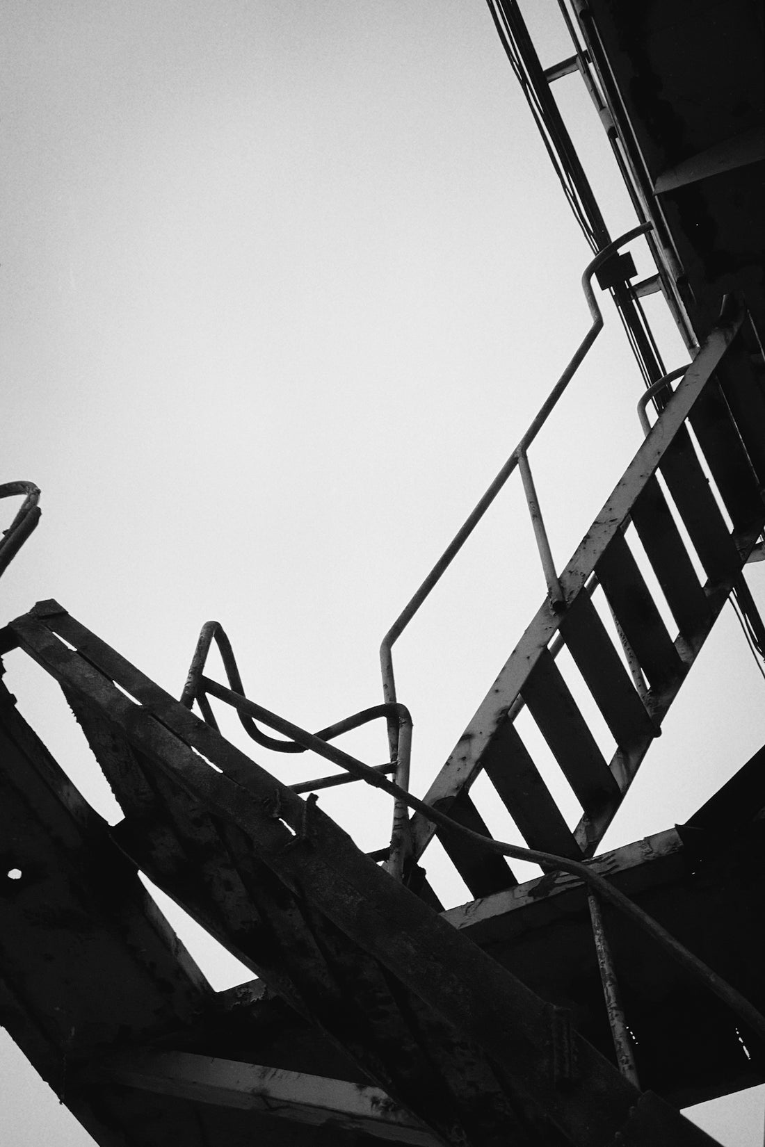 grayscale photo of emergency ladder