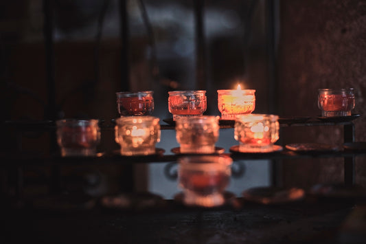 lighted candles on brown wooden table
