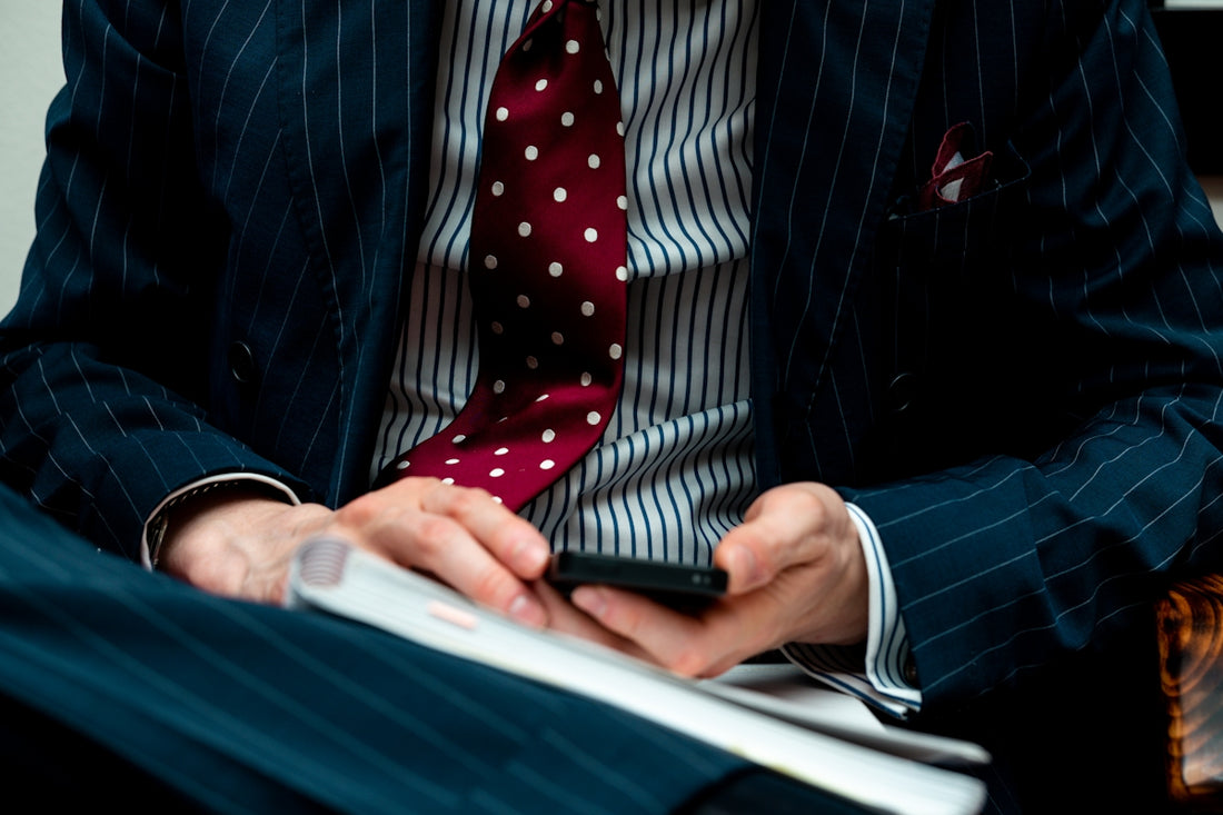 man in black suit jacket using black laptop computer