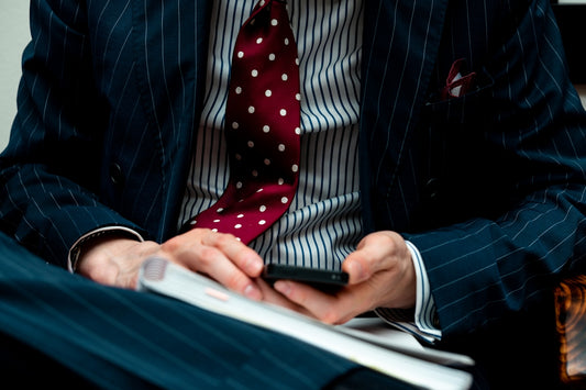 man in black suit jacket using black laptop computer
