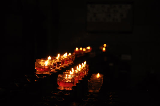 lighted candles on black surface