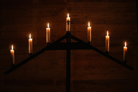 white candles on brown wooden floor