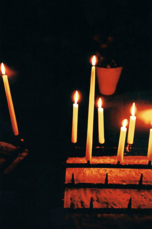 candles on brown wooden holder