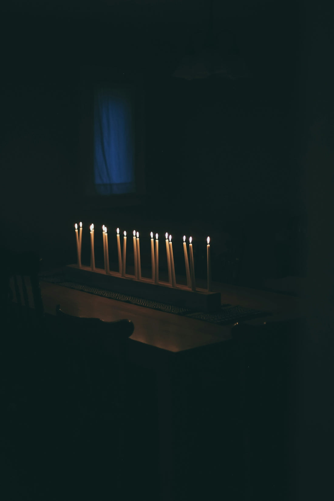 white candles on brown wooden table