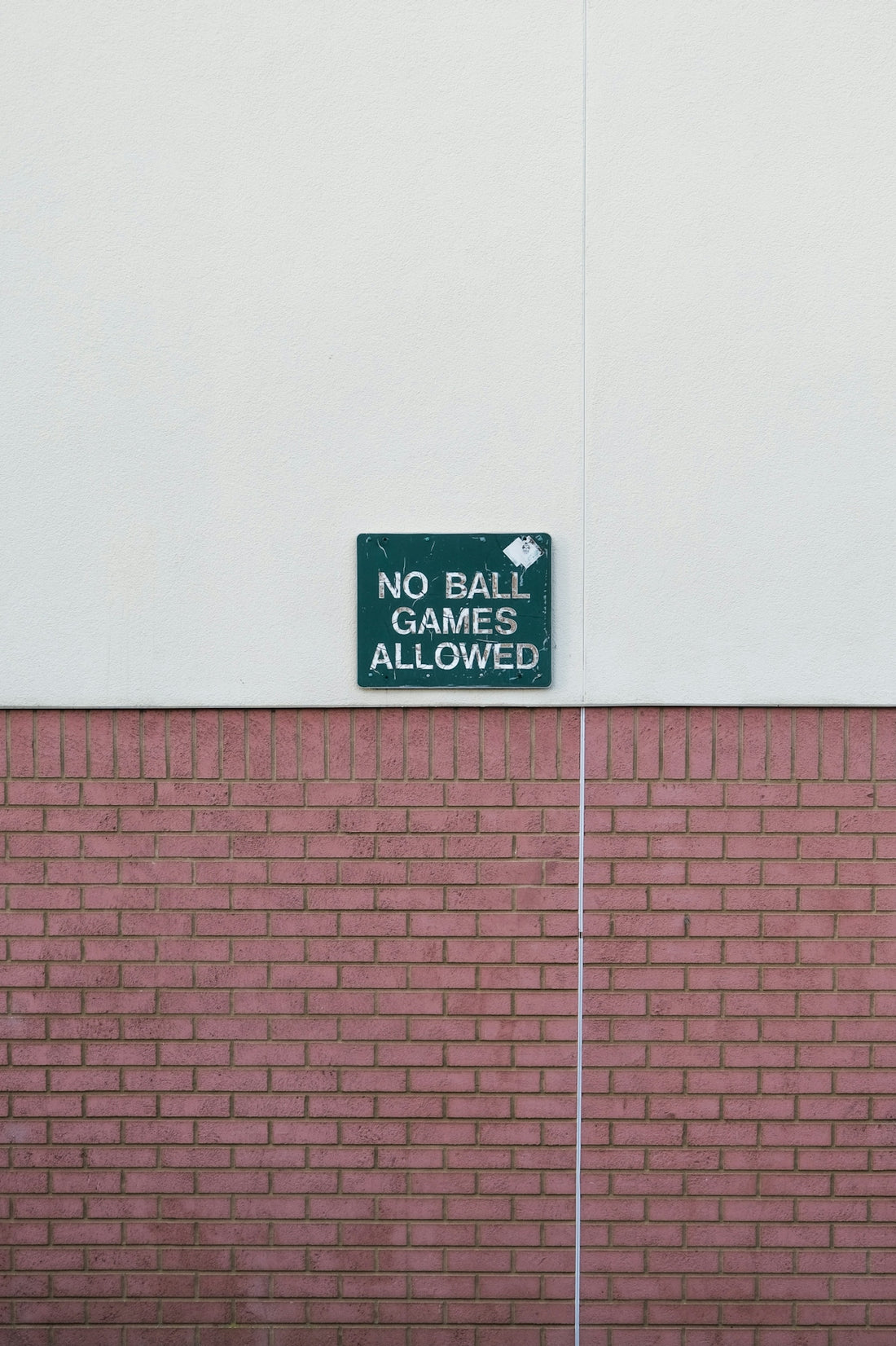 no smoking sign on pink wall