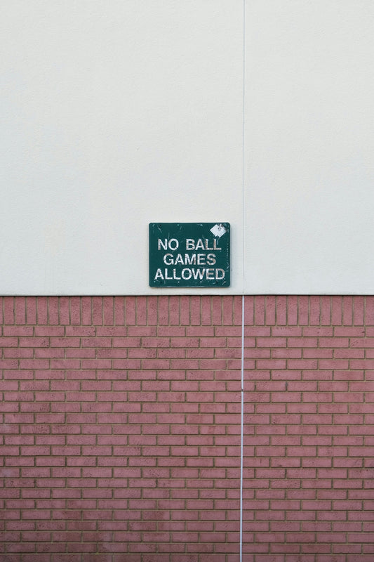 no smoking sign on pink wall