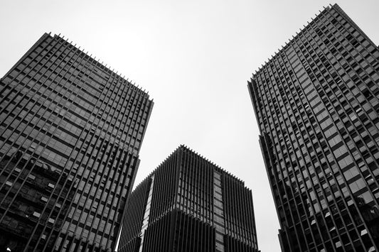 a black and white photo of some very tall buildings