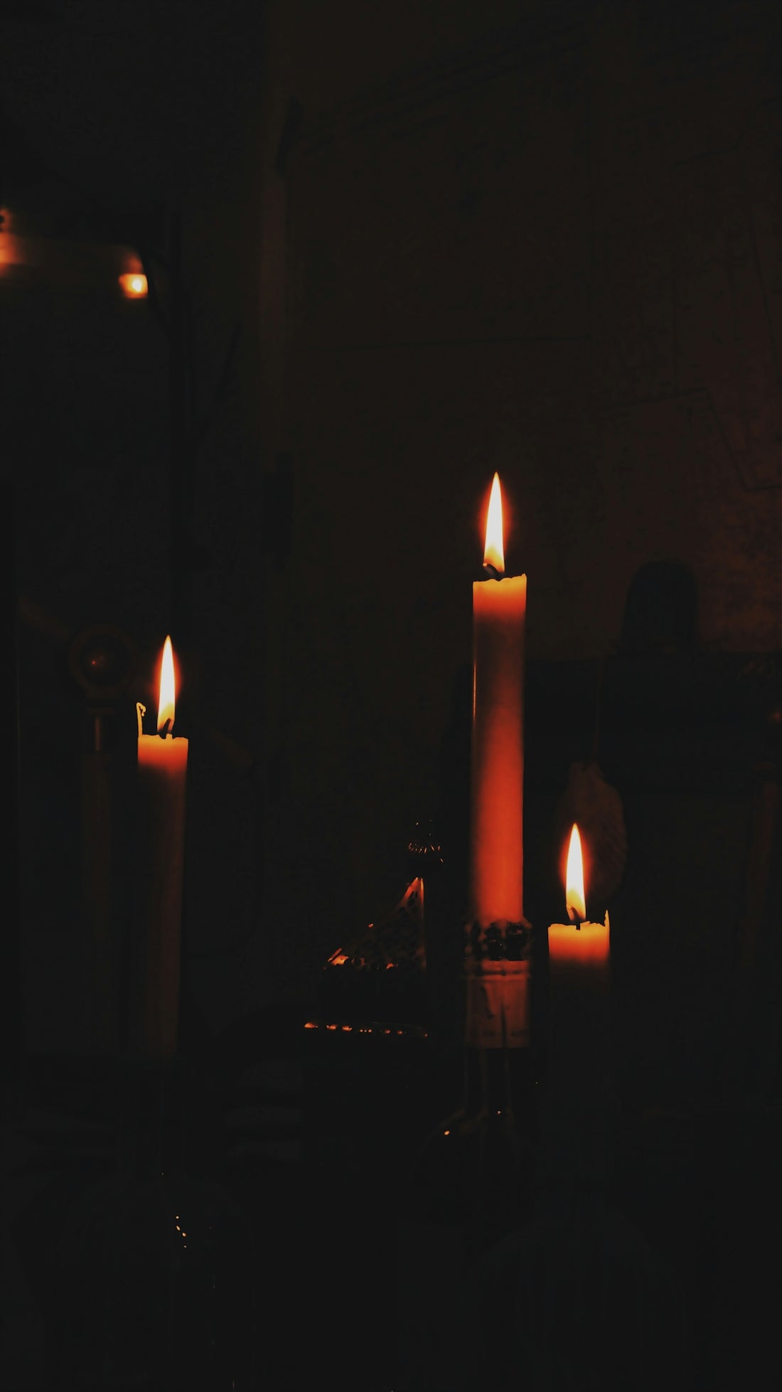 lighted candles on black surface