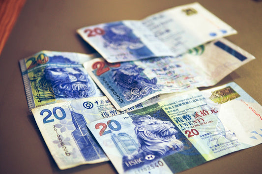 20 and 50 banknotes on brown wooden table