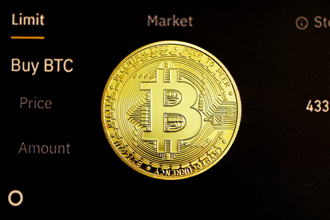 gold round coin on black surface