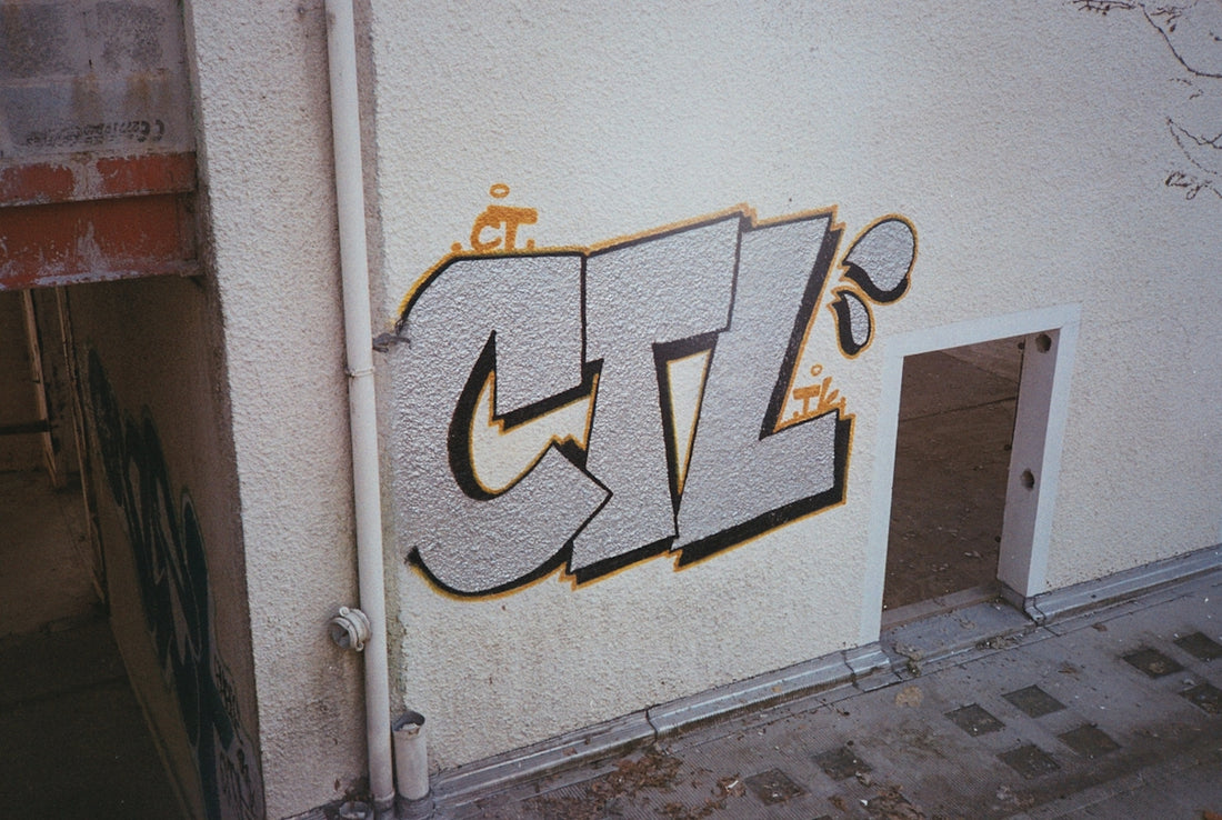 graffiti on the side of a building with a door