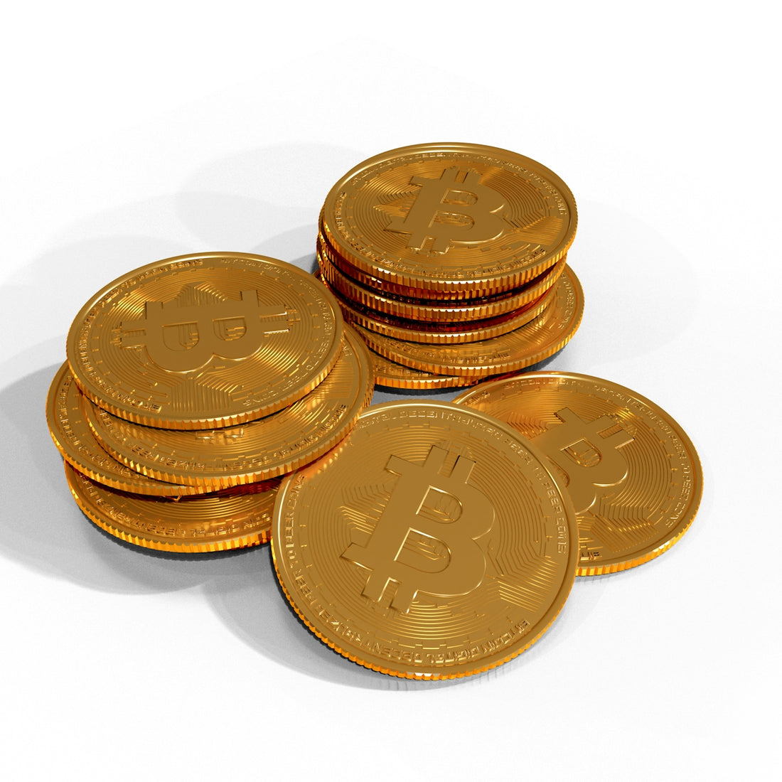 a pile of gold bitcoins sitting on top of each other