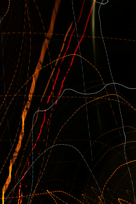 an abstract photo of a street light at night