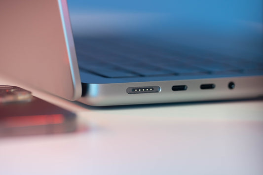 a laptop computer sitting on top of a table