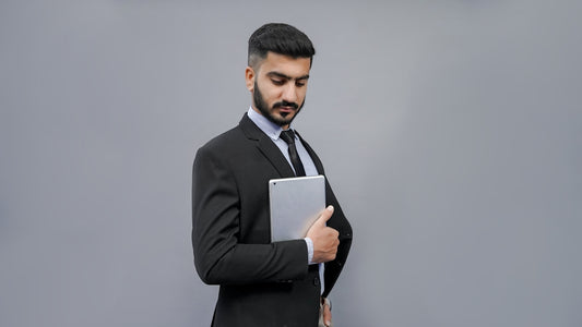 a man holding a tablet