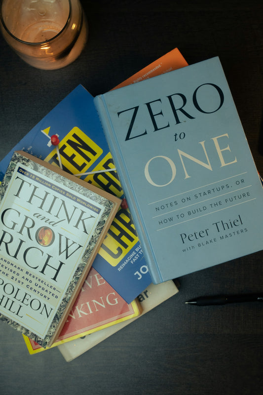 a stack of books sitting on top of a table