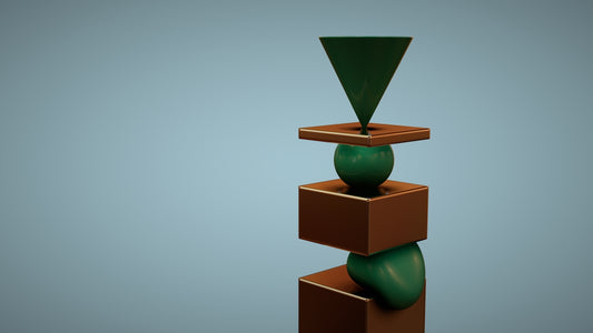 a green vase sitting on top of a wooden block