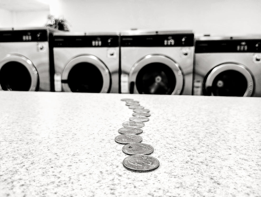 a row of coin sitting on top of a counter