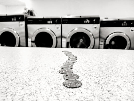 a row of coin sitting on top of a counter