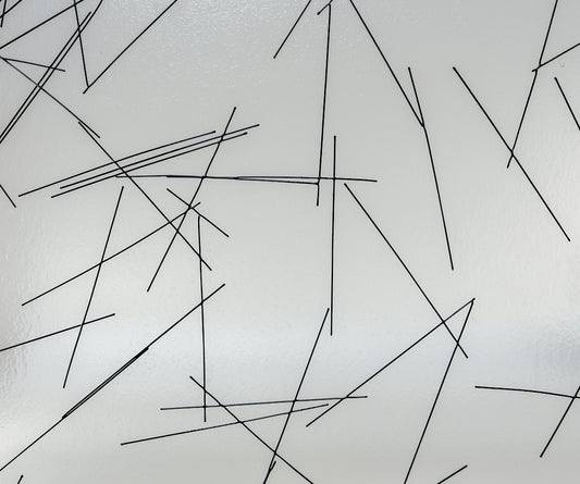 a white wall with black lines on it