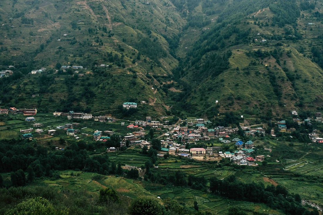 a small village nestled in a valley surrounded by mountains