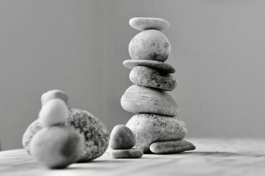 a stack of rocks sitting on top of a wooden table