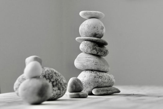 a stack of rocks sitting on top of a wooden table