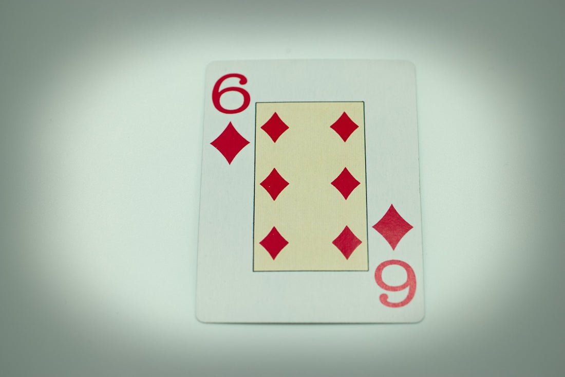 a close up of a playing card on a table