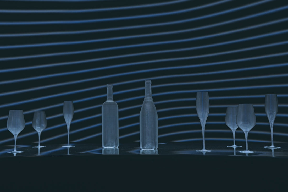 a row of wine glasses sitting next to each other