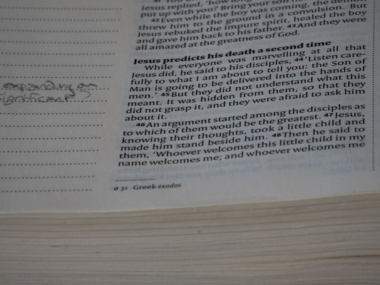 A close up of a book with writing on it