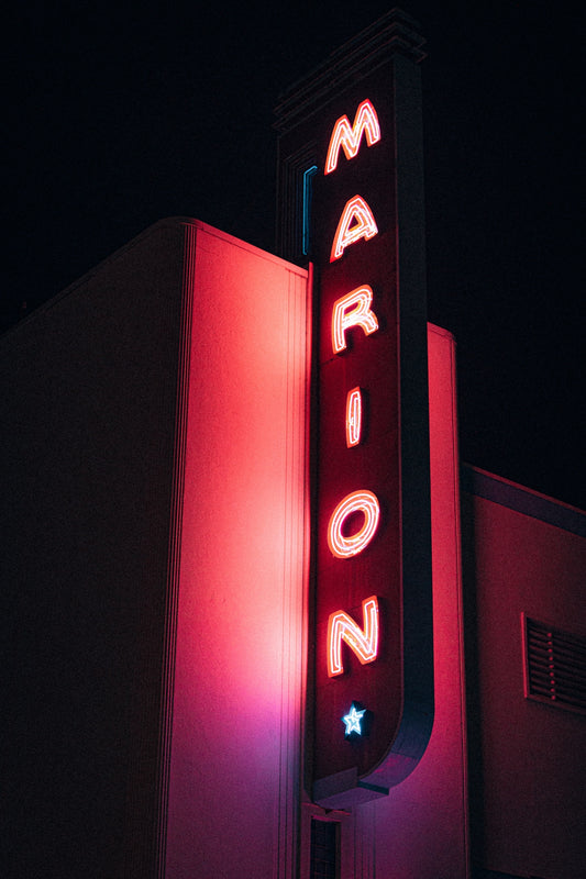 A marquee sign lit up at night