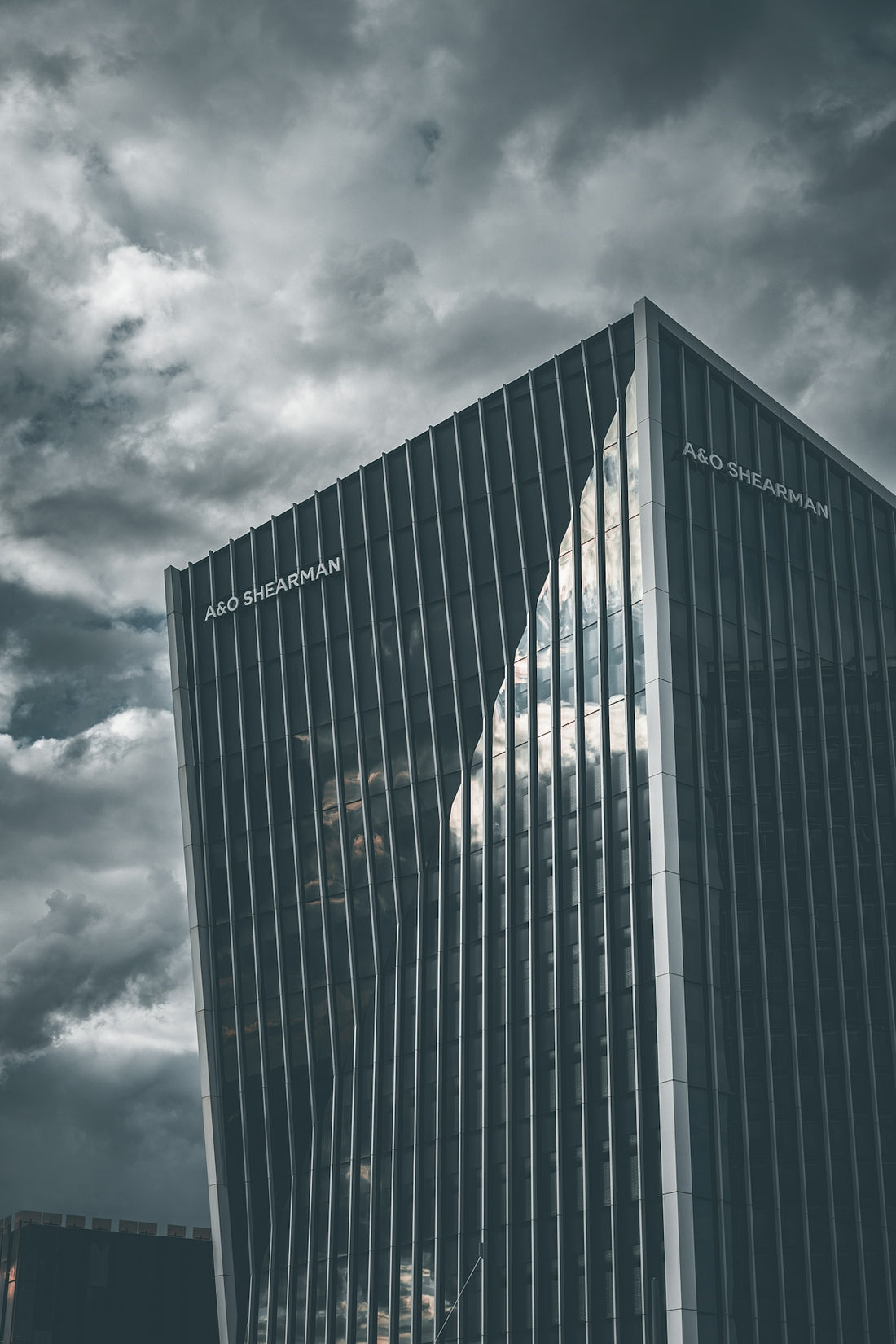 A tall building sitting under a cloudy sky