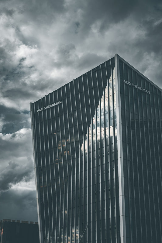 A tall building sitting under a cloudy sky