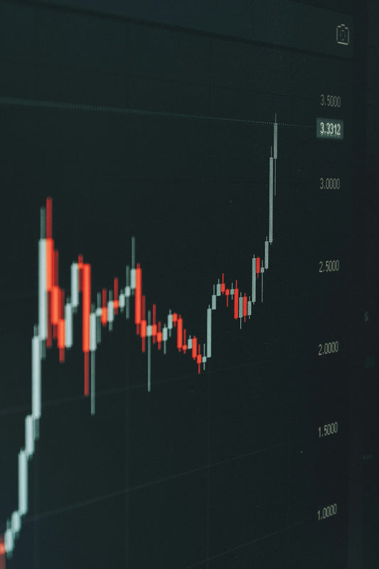 Stock market graph shows fluctuating trends.