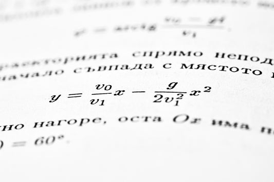 A mathematical formula is shown on an open book.