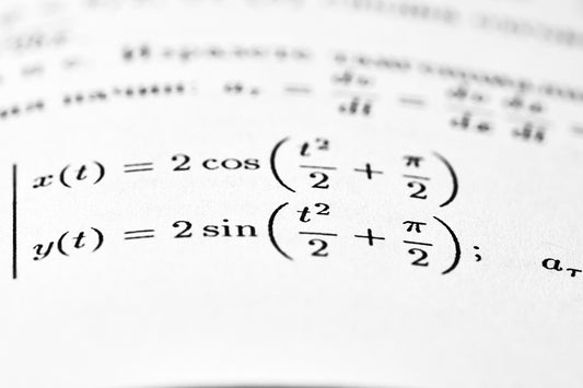 Mathematical equations are shown on a printed page.