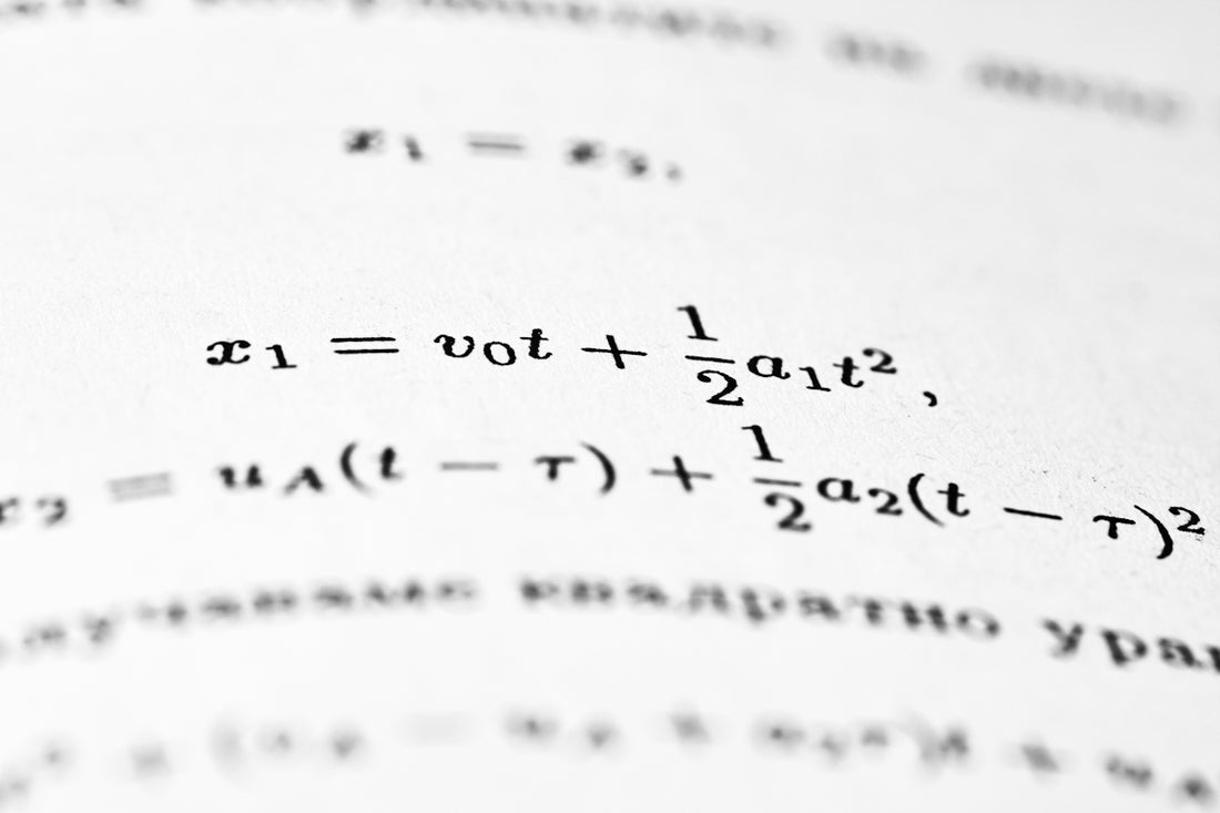 Mathematical equations are written on a white page.