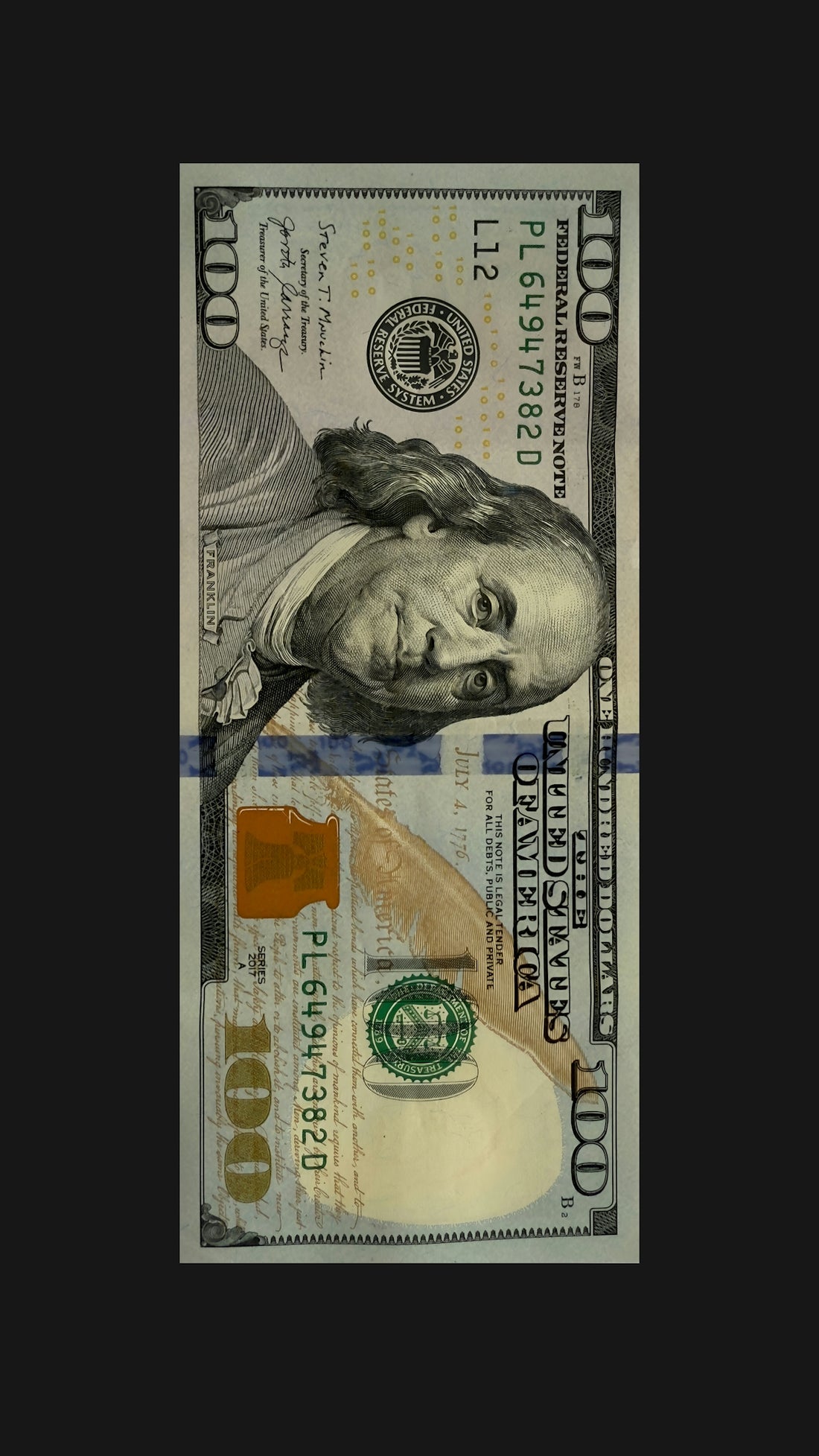 A portrait of a hundred-dollar bill.