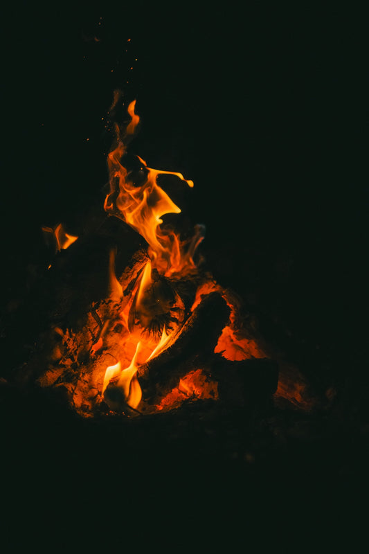 Burning flames illuminate the dark night.